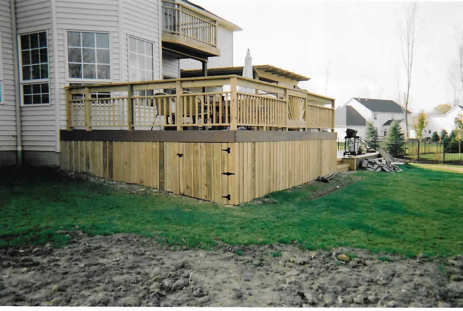 Completed wood deck and railing project by King Home Improvement