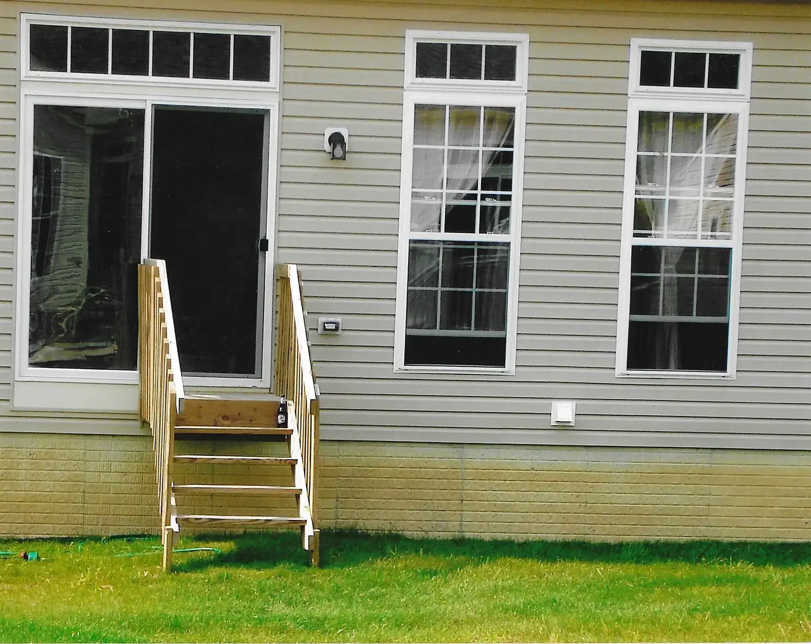 Exterior wood steps and railing work completed by King Home Improvement